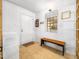 Bright entryway featuring tiled flooring, a bench, and a storage shelf at 1301 Lynnwood Rd, Knightdale, NC 27545