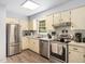Bright kitchen boasts stainless steel appliances and tile backsplash at 1301 Lynnwood Rd, Knightdale, NC 27545