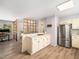 Open kitchen offers stainless steel appliances and breakfast bar at 1301 Lynnwood Rd, Knightdale, NC 27545