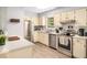 Modern kitchen boasts stainless steel appliances and plenty of counter space at 1301 Lynnwood Rd, Knightdale, NC 27545