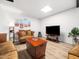 Cozy living room with comfortable seating, a TV, and a decorative coffee table at 1301 Lynnwood Rd, Knightdale, NC 27545
