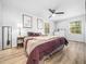 Cozy main bedroom with ceiling fan, luxury flooring, and lots of light at 1301 Lynnwood Rd, Knightdale, NC 27545