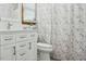 Bright bathroom with white vanity and a decorative shower curtain at 13816 N Meadows Ct, Wake Forest, NC 27587
