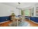Dining room with a modern chandelier and natural light at 13816 N Meadows Ct, Wake Forest, NC 27587