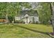 Charming single-story home with a manicured lawn and mature trees at 13816 N Meadows Ct, Wake Forest, NC 27587