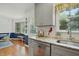 Updated kitchen with stainless steel dishwasher and granite countertops at 13816 N Meadows Ct, Wake Forest, NC 27587