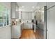 Compact, modern kitchen featuring new cabinets and stainless steel appliances at 13816 N Meadows Ct, Wake Forest, NC 27587