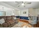 View of a cozy living room with a ceiling fan and hardwood floors at 13816 N Meadows Ct, Wake Forest, NC 27587