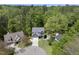 Aerial shot showcasing a well-maintained house with lush greenery and mature trees in a suburban setting at 1401 Freshwater Ct, Wake Forest, NC 27587