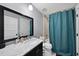 Bathroom featuring a dark vanity with a white sink and silver faucet at 1401 Freshwater Ct, Wake Forest, NC 27587