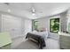 White bedroom with gray carpet and two windows at 1401 Freshwater Ct, Wake Forest, NC 27587