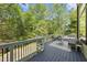 The back deck has outdoor seating and faces the woods at 1401 Freshwater Ct, Wake Forest, NC 27587