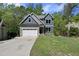 Charming two-story home featuring a manicured lawn, a two-car garage, and a welcoming front entrance at 1401 Freshwater Ct, Wake Forest, NC 27587