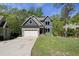Inviting two-story home featuring a manicured lawn, a two-car garage, and a welcoming front entrance at 1401 Freshwater Ct, Wake Forest, NC 27587
