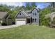 Charming home with attached garage, beautiful landscaping, and inviting curb appeal at 1401 Freshwater Ct, Wake Forest, NC 27587