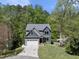 An elevated view of a two-story home with a two-car garage, driveway, and landscaping at 1401 Freshwater Ct, Wake Forest, NC 27587