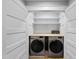 A laundry room features two Samsung washing machines at 1401 Freshwater Ct, Wake Forest, NC 27587