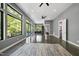 Open living room with large windows offering scenic views and natural light at 1401 Freshwater Ct, Wake Forest, NC 27587