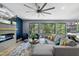 Inviting living room with a modern fireplace, comfortable seating, and scenic views from the large windows at 1401 Freshwater Ct, Wake Forest, NC 27587