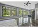 Open living room with large windows offering scenic views and natural light at 1401 Freshwater Ct, Wake Forest, NC 27587