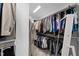 Spacious walk-in closet with extensive built-in shelving and hanging space for maximum organization at 1401 Freshwater Ct, Wake Forest, NC 27587