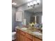 Bathroom boasts a granite countertop with double sinks and a glass-enclosed shower at 141 Steel Hopper Way, Garner, NC 27529