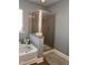 Bright bathroom features a separate shower and a soaking tub for relaxation at 141 Steel Hopper Way, Garner, NC 27529