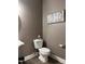 Comfortable half bathroom, complete with elegant fixtures, a decorative sign, and tile flooring at 141 Steel Hopper Way, Garner, NC 27529