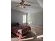 Spacious bedroom featuring neutral carpet, light blue walls, and a ceiling fan at 141 Steel Hopper Way, Garner, NC 27529