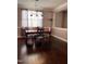 Dining room with hardwood floors, a wooden table, and four chairs at 141 Steel Hopper Way, Garner, NC 27529
