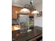 Kitchen island with stainless steel appliances, granite countertop, pendant lighting and ample cabinet space at 141 Steel Hopper Way, Garner, NC 27529