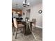 Bright kitchen with table, stainless steel appliances, and tile flooring at 141 Steel Hopper Way, Garner, NC 27529