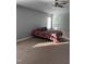 Light filled primary suite featuring tray ceilings, fan, neutral carpet, and natural light at 141 Steel Hopper Way, Garner, NC 27529