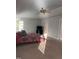 Spacious main bedroom featuring vaulted ceilings, fan, neutral carpet, and plenty of natural light at 141 Steel Hopper Way, Garner, NC 27529