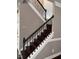 A captivating staircase featuring dark wood treads and intricate wrought iron railings at 141 Steel Hopper Way, Garner, NC 27529