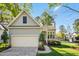 Charming home with a two-car garage and lovely landscaping at 1433 Deltona Dr, Raleigh, NC 27615