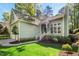 Inviting home exterior with manicured lawn and garden at 1433 Deltona Dr, Raleigh, NC 27615