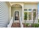 Close-up of the home's entrance with brick stairs and porch at 1433 Deltona Dr, Raleigh, NC 27615