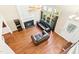 Spacious living room with hardwood floors, fireplace, and plenty of natural light at 1433 Deltona Dr, Raleigh, NC 27615