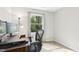 Bright office space with modern desk, natural light, and a view of the outdoors at 1433 Deltona Dr, Raleigh, NC 27615