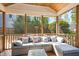 Relaxing screened porch with comfortable seating and view of the backyard at 1433 Deltona Dr, Raleigh, NC 27615