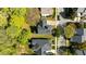 Aerial view of the home highlighting the roof and tree-lined street, surrounded by neighboring houses at 1526 Town Home Dr, Apex, NC 27502