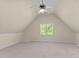 Spacious bedroom with a vaulted ceiling, carpeted floor, a window, and a ceiling fan at 1526 Town Home Dr, Apex, NC 27502