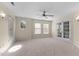 Carpeted bedroom with ceiling fan and windows at 1526 Town Home Dr, Apex, NC 27502