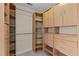 Walk-in closet with wood shelving and drawers at 1526 Town Home Dr, Apex, NC 27502
