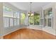 Bright breakfast nook surrounded by windows, offering a serene view and natural light at 1526 Town Home Dr, Apex, NC 27502