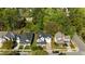 Aerial view of multiple houses, highlighting the varied architectural styles and well-maintained landscaping of the neighborhood at 1526 Town Home Dr, Apex, NC 27502