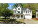 Charming two-story home with a welcoming front porch and well-maintained landscaping at 1526 Town Home Dr, Apex, NC 27502