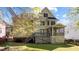 Back exterior of a two-story house featuring a deck, porch, and backyard at 1526 Town Home Dr, Apex, NC 27502