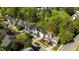Aerial view of multiple houses showcasing manicured lawns, mature trees, and a desirable neighborhood at 1526 Town Home Dr, Apex, NC 27502